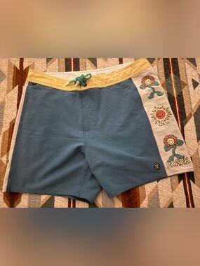 Roark Light Blue Swim Shorts with Cream Panels and Yellow Waistband